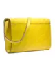 Yellow printed leather clutch bag